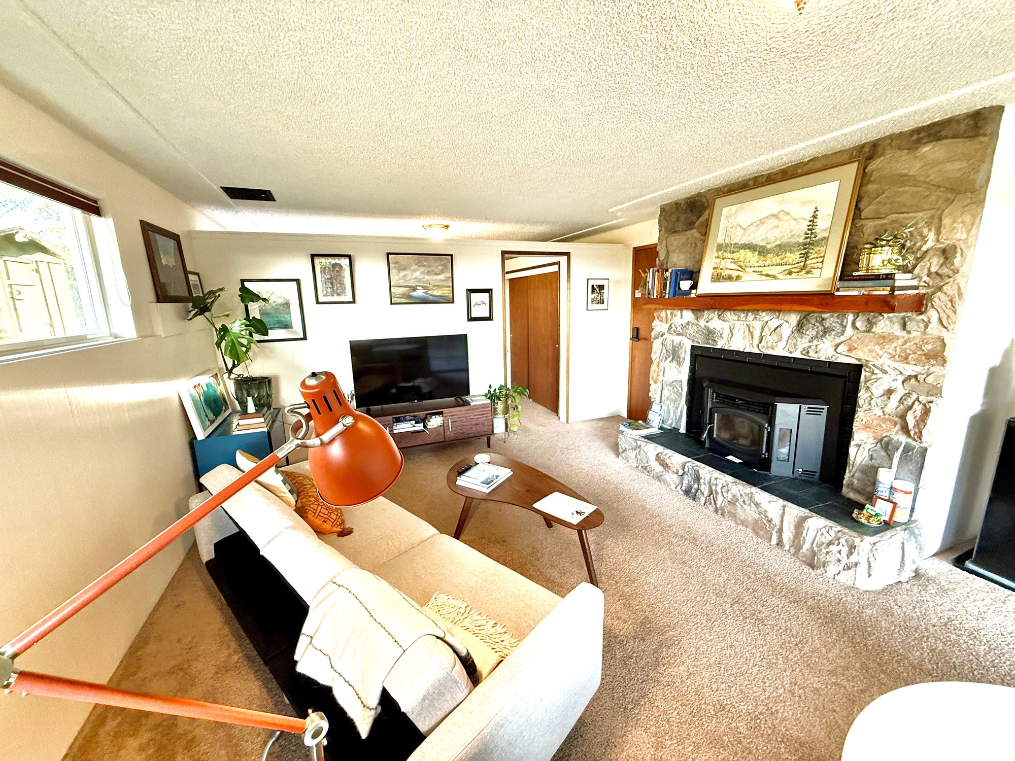 Living room with stone fireplace
